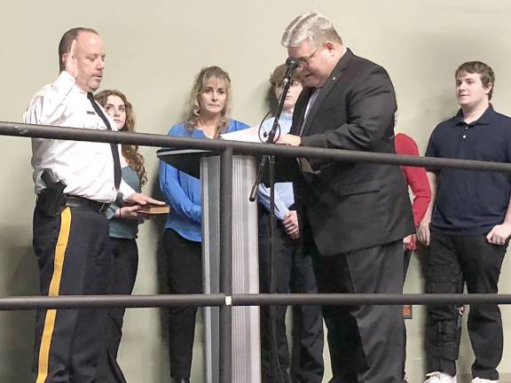 Sussex County Sheriff Michael Strada, left, is sworn in for a new three-year term by state Sen. Steven Oroho.