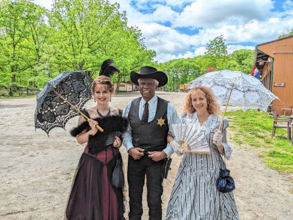 Cee-Cee Deslaurier-Tate, left, and her mother, Carolyn, with actor Kenn Hill at Wild West City.