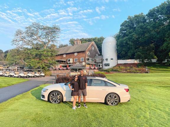 Benny’s Bodega founders Heather and Benjamin Davey in front of an Audi A6. Audi of Newton was one of the sponsors of the nonprofit’s first golf outing July 15 at Farmstead Golf &amp; Country Club in Lafayette.