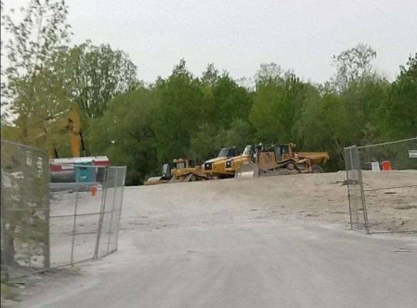 Heavy equipment sits ready to go to work on the site of the future Pace Glass Recycling, Inc. processing facility on Limecrest Road in Andover Township. Photos by mandy Coriston