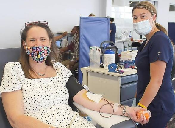 A woman donates blood at a recent drive event organized by the New York Blood Center.