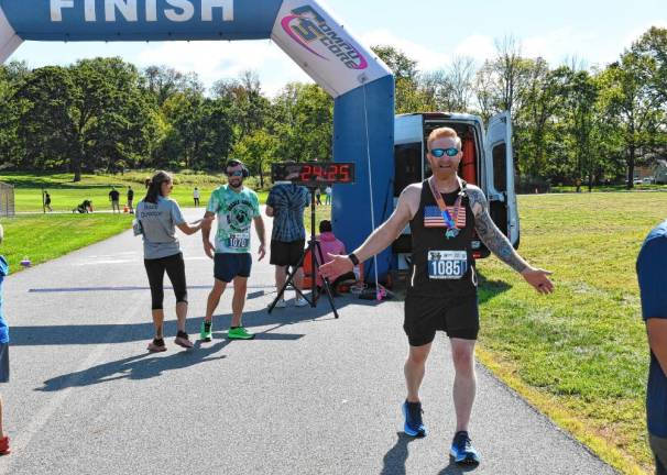 Mark Hennion, 54, of Branchville finishes seventh with a time of 24:08.82.