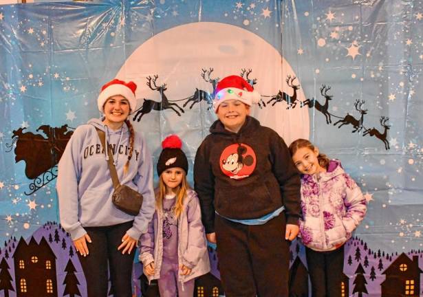 Anna Agnoli, Brianna Bonkoski, Mason Agnoli and Sophia Fisher pose for a photo inside the Cranberry Lake Firehouse.