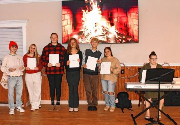 Members of the Lenape Valley Regional High School choir perform holiday songs.