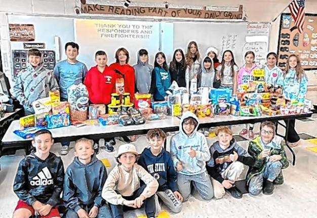 WF4 Sixth-grade students at Macopin Middle School in West Milford with items they collected for first-responders fighting the wildfires. (Photo provided)