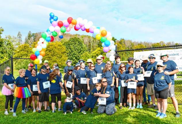 <b>Members of Noah’s Bulldogs walk in memory of Noah Leyman, formerly of Hampton Township, who died in a highway crash in June 2023 while serving in the Air Force. He was 22.</b>