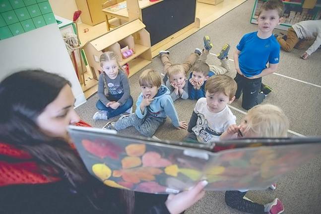 Little Sprouts Early Learning Center teacher Leann Eaton reads to the preschool class.