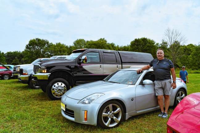 Russ Eaton of Stillwater stands by his silver 2006 Nisan 350Z.