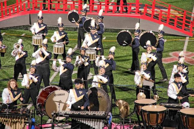 <b>The Vernon Township High School Marching Band performs during halftime.</b>