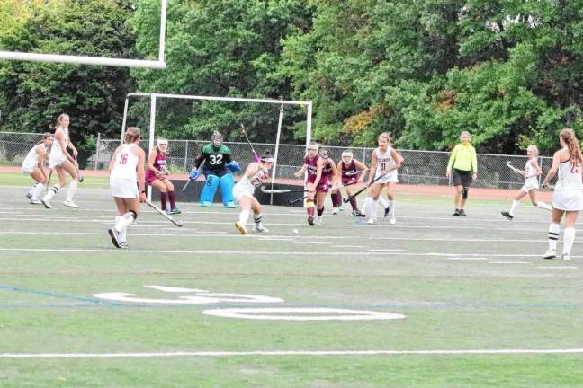 The Newton Braves defend their goal post as Voorhees Viking Isabella Settembrini (22) attempts to shoot.