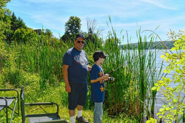 SF4 Sam Vilagos fishes with his grandfather John Manno.