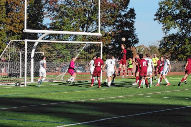 The soccer ball bounces off a Newton Brave’s head in front of the Jefferson goalpost.