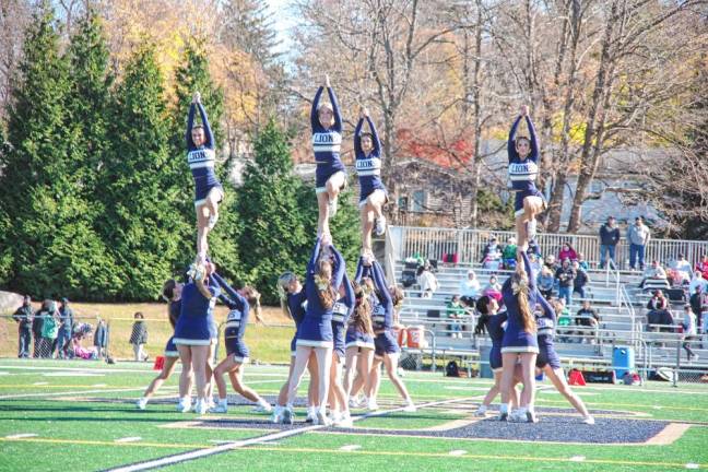 <b>The Pope John XXIII Regional High School cheerleaders perform during halftime. (Photo by George Leroy Hunter)</b>