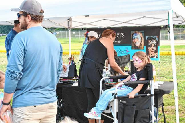 Vendors include face painting.