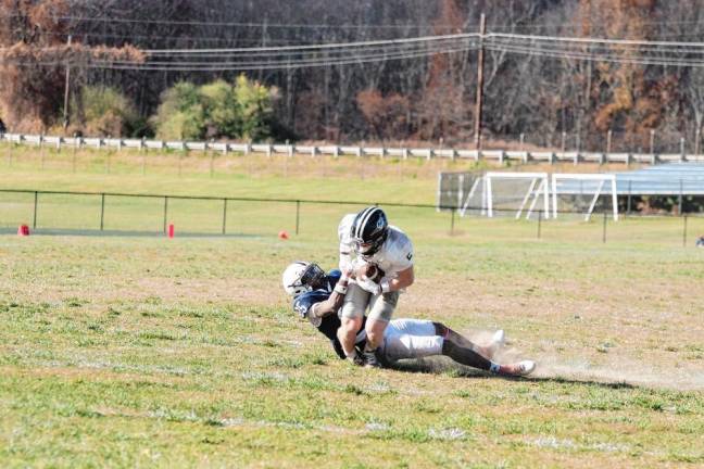 A Sussex County defender brings down a DuPage ball carrier in the first half.