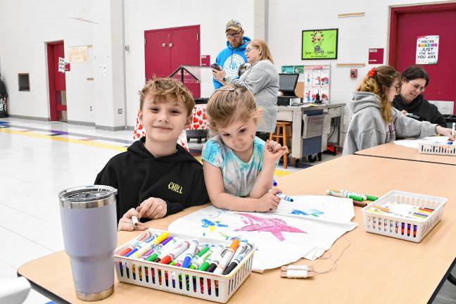 Cayden and McKenna Reid decorate their kite.