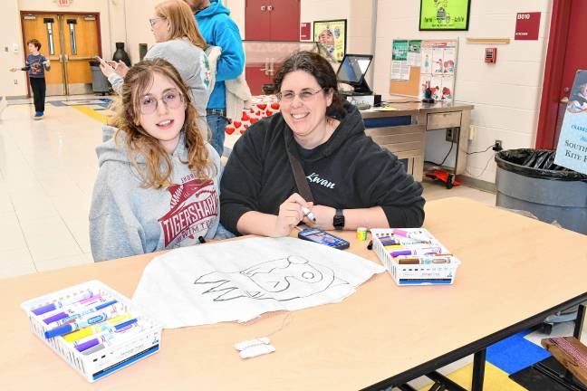 Haddie and Carrie Kreider decorate their kite.