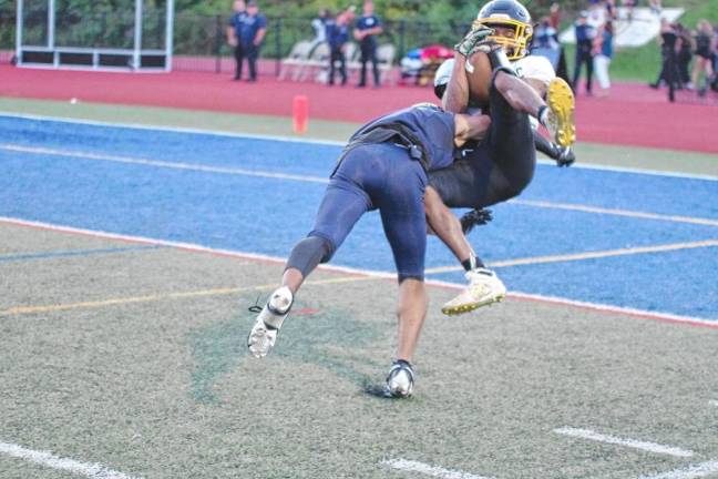 <b>FB2 West Milford wide receiver Marcus Morgan catches a long-range pass in the first half. He landed just short of the goal line. </b>