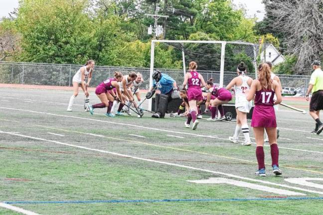 Newton Braves defend their goal post from attacking Voorhees Vikings.