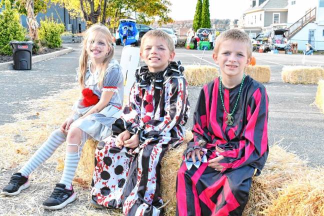 Bryanna, Jaxson and Bryson Morse dressed as clowns.