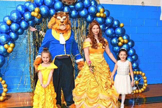 Little princesses pose with the Beauty and the Beast at the Prince &amp; Princess Ball on Friday, Feb. 21 at the Franklin Borough School.