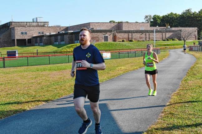 5K participants run past the high school.