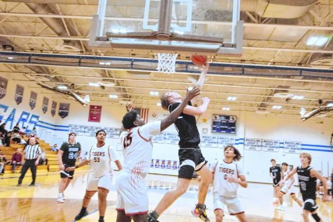 Kittatinny's Luke Kramer handles the ball during a game against Dover on Jan. 16. The Cougars won, 76-75. (Photos by George Leroy Hunter)