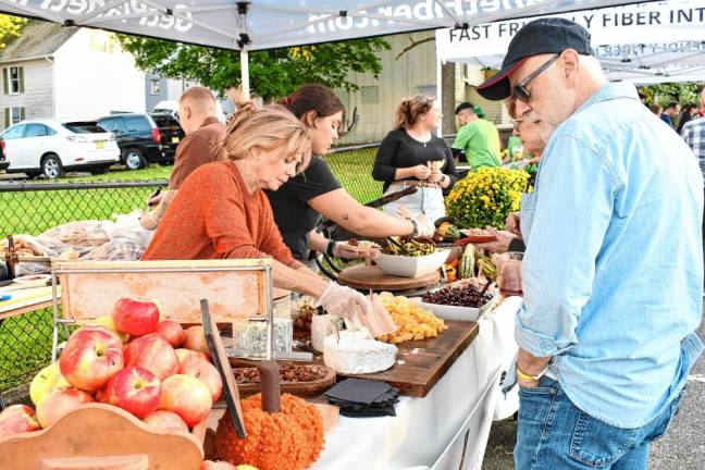 Restaurants and culinary businesses offer samples of their cuisine at Taste of Newton on Monday, Sept. 9 in the Central Plaza Parking Lot. (Photos by Maria Kovic)