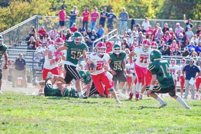 <b>Sussex Tech defenders pursue Lenape Valley ball carrier Kevin Giusti, who rushed for 289 yards and scored two touchdowns. (Photo by George Leroy Hunter)</b>