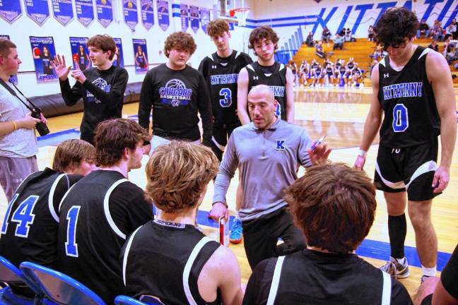 Kittatinny basketball head coach Mike Lupo speaks to players during a timeout.