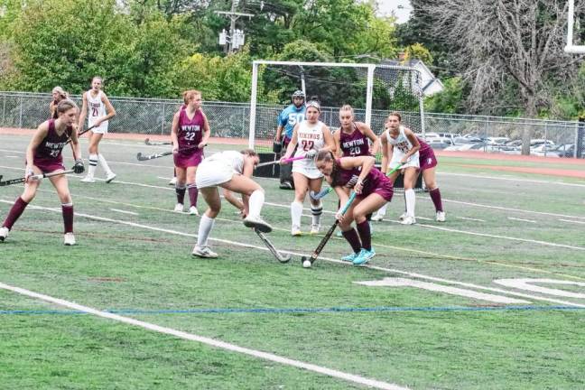 Newton Braves and Voorhees Vikings battle for control of the ball. Newton won the match, 3-0, at home Sept. 28. (Photos by George Leroy Hunter)