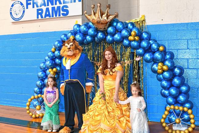 Children pose with the Beauty and the Beast at the Prince &amp; Princess Ball on Friday, Feb. 21 at the Franklin Borough School.