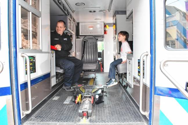 Joseph Atkinson and Callum MacKenzie of Newton look inside an ambulance.