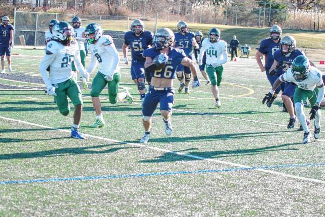 <b>Pope John running back Luke Gialanella carries the ball in the open field. He made two touchdowns and rushed for 89 yards. (Photo by George Leroy Hunter)</b>