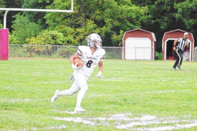 <b>Wallkill Valley kick returner Connor Hoebee is on the move in the first half. He made two receptions for 45 yards, resulting in one touchdown.</b>