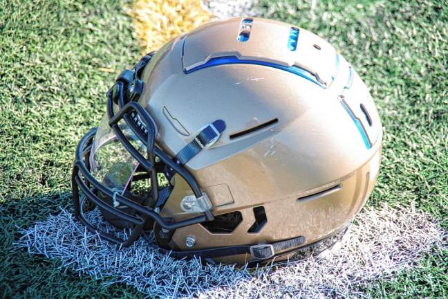 <b>The sun shines on a Pope John Lions helmet. (Photo by George Leroy Hunter)</b>