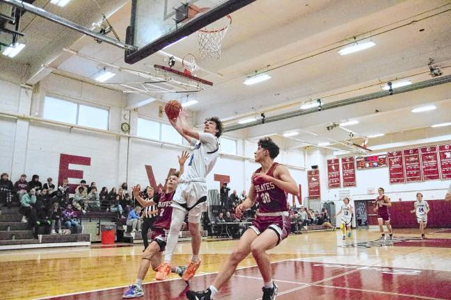 Kittatinny's Michael Strong raises the ball during a shot. He scored 21 points.