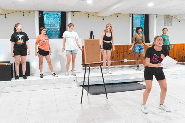 <b>Jenna Flake, front, playing Elle, rehearses with Delta Nu sisters played by, from left, Katie Colgan, Marley Lane, Maya McQueen, Ella Simmons, Arianna Costillo and McKenna Vasquez. (Photos by Jodi Halteman)</b>