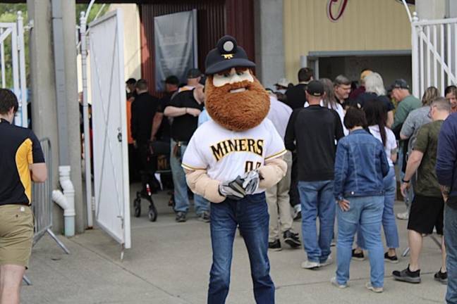 The team mascot, Herbie, greets fans as they enter Skylands Stadium.