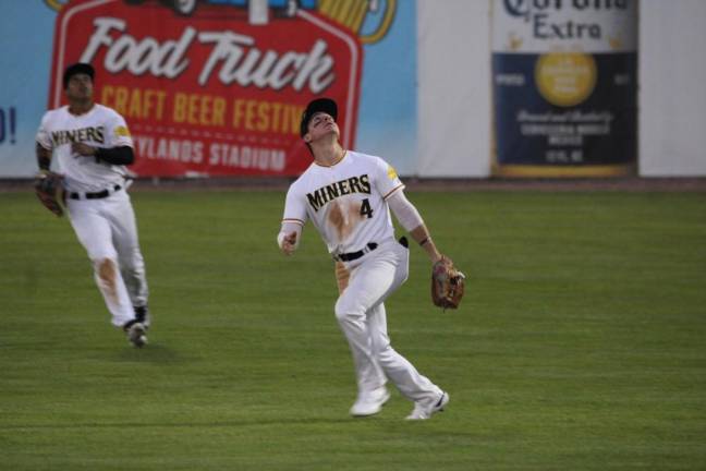 Infielder Willie Escala tracks down a fly ball.