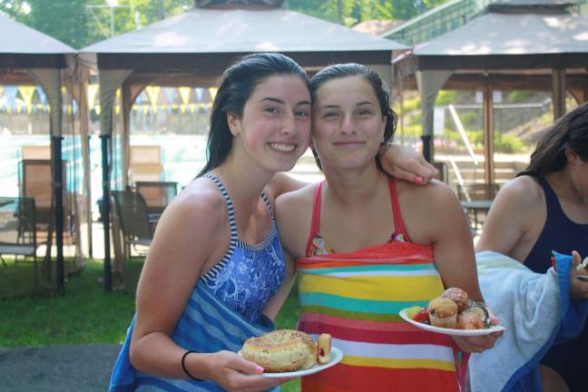 Valerie &amp; Sam Russo fuel up after swimming several laps.