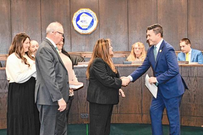 State Assemblyman Michael Inganamort congratulates Helen Le Frois, who was named mayor at the Town Council’s annual reorganization meeting Jan. 15. (Photos by Maria Kovic)