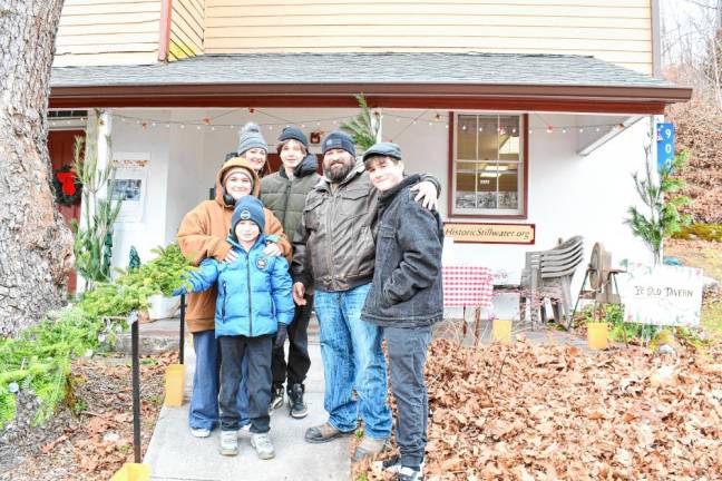 Anthony, Nina, Jessica, Jason, AJ and Jax Muro of Stillwater in front of the old tavern.