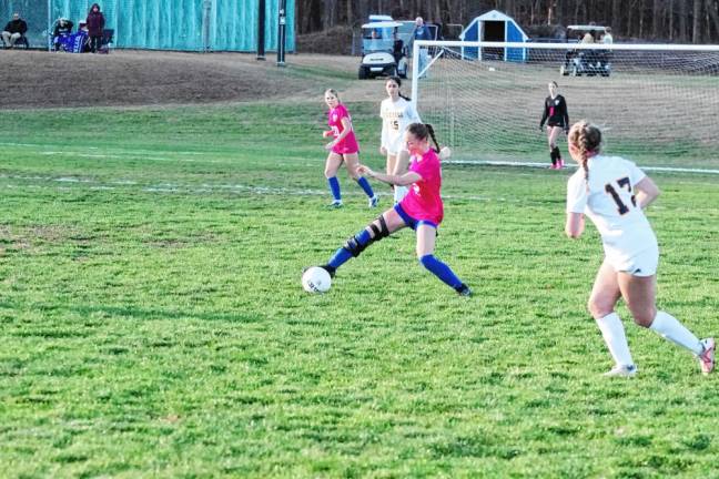 Kittatinny's Katie Sajdak is about to kick the ball.