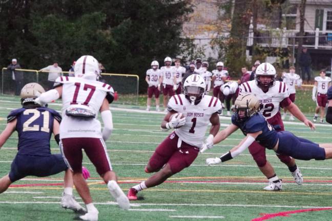 Don Bosco ball carrier Logan Bush finds an opening.