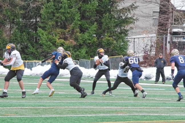 The St. John Vianney offensive line holds back the Pope John defense to give quarterback Zach LaBarca enough time to throw the ball. LaBarca made a touchdown in the first quarter.