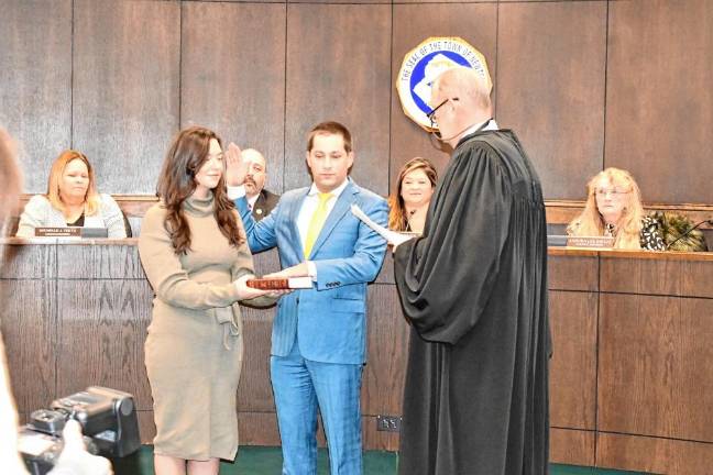 John-Paul Couce takes the oath of office for his second term on the Town Council.