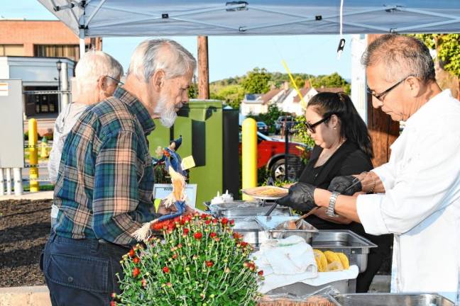 Restaurants and culinary businesses offer samples of their cuisine at Taste of Newton on Monday, Sept. 9 in the Central Plaza Parking Lot. (Photo by Maria Kovic)