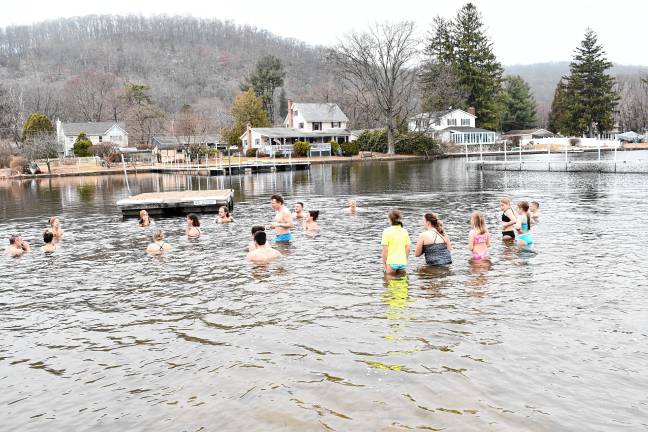 About two dozen people take part in the annual Polar Plunge at Lake Lackawanna Beach in Stanhope on Sunday, March 16. It had been postponed from Feb. 16. (Photos by Maria Kovic)