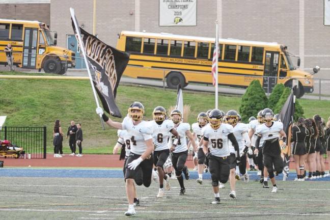 <b>The West Milford Highlanders charge onto the field.</b>